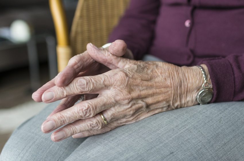 Lewy body dementia: image is of hands of elderly women clasped together in her lap
