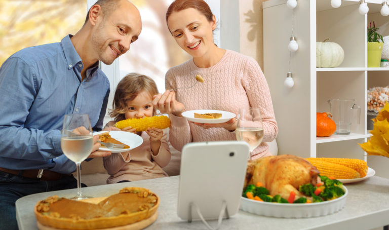 Family having Thanksgiving dinner with Zoom