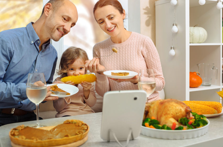 Family having Thanksgiving dinner with Zoom