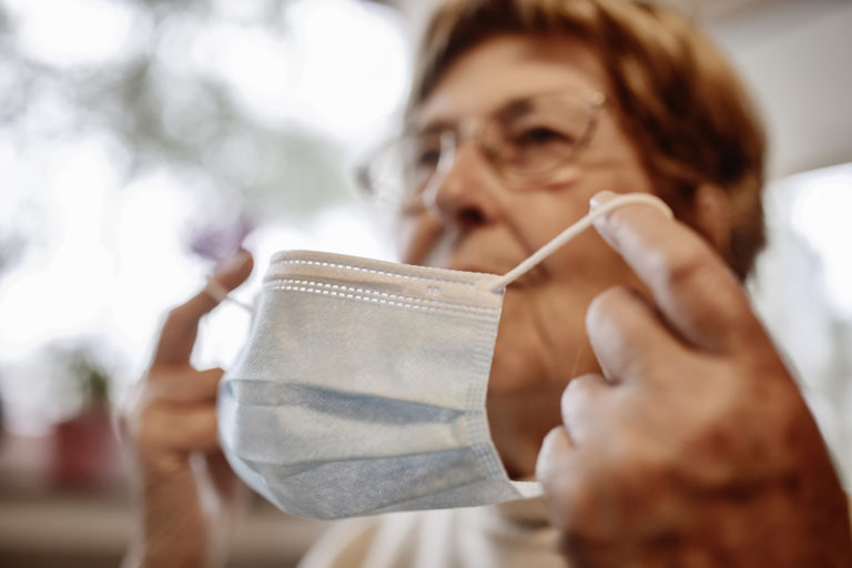 Elderly woman wearing mask