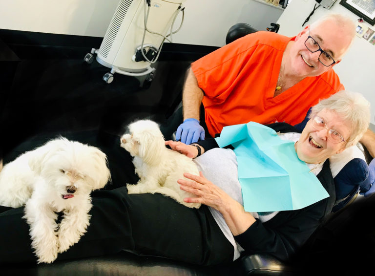 Dean Nicholas, DDS with patient. The importance of oral health for seniors.