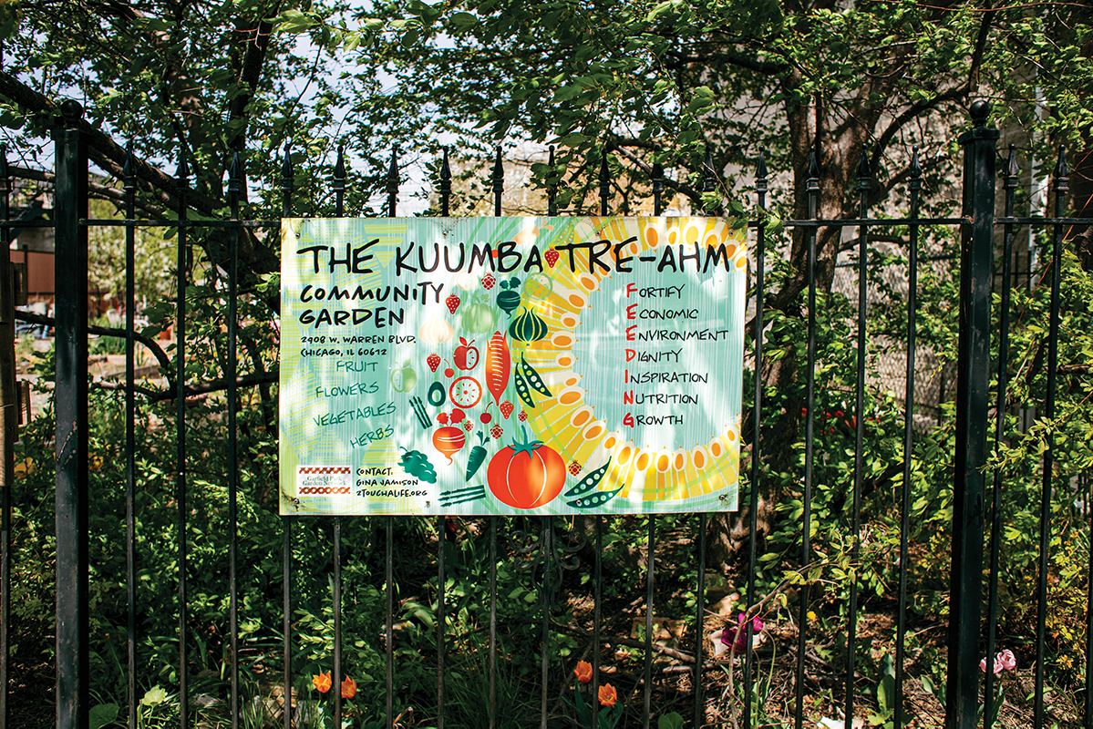 Kuumba Tre-Ahm Community Garden Sign on Fence Post
