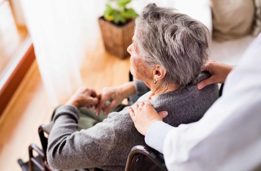Elderly woman receives massage for Dementia treatment