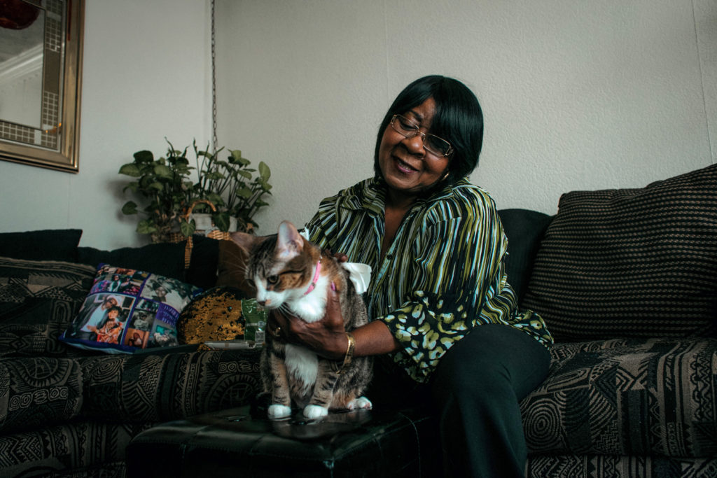 Vera Starnes and her cat, Honey. Pet Companionship. Photo by Jim Vondruska