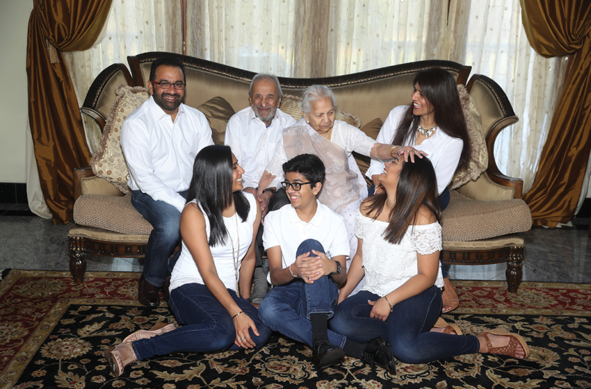 Jivabhai and Shantaben Patel (center) surrounded by their family.