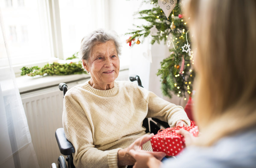 woman with dementia receiving a gift