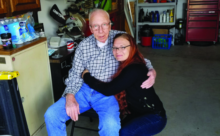 Kim Hauser with her grandfather, Roger Proffer