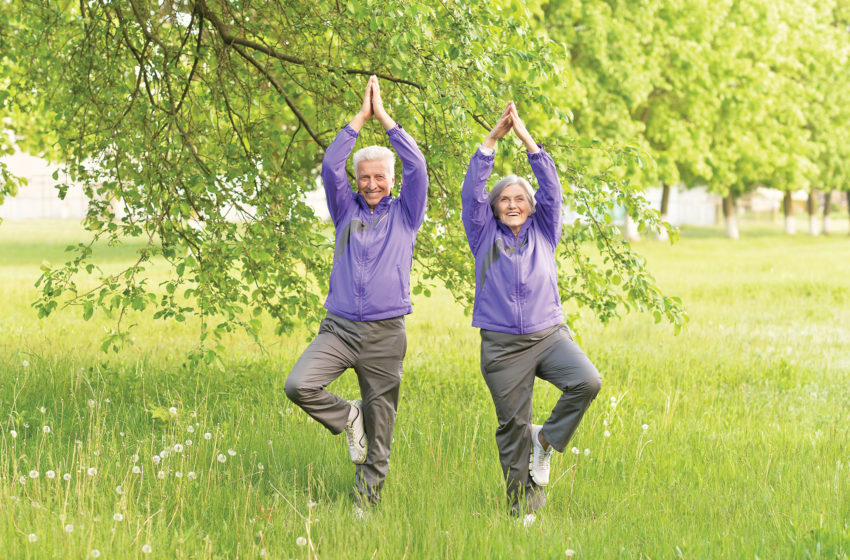 Seniors practicing balance exercises