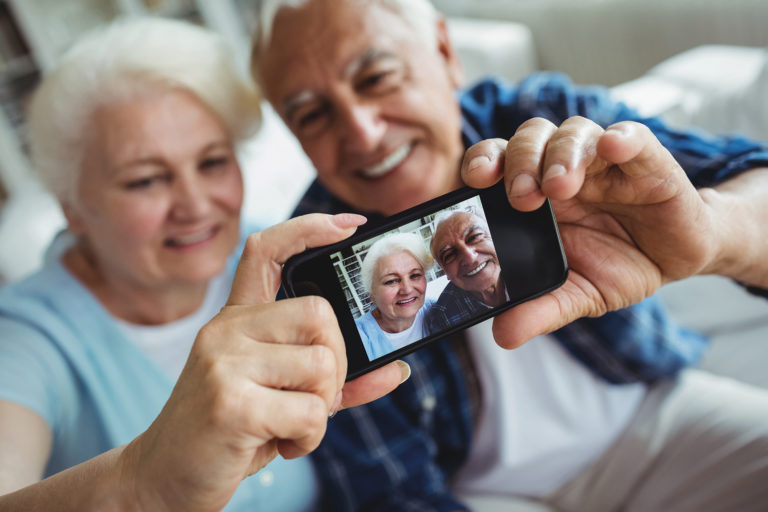 Seniors using a smartphone, technology