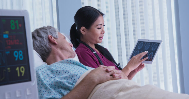 Head injury doctor showing patient brain scan