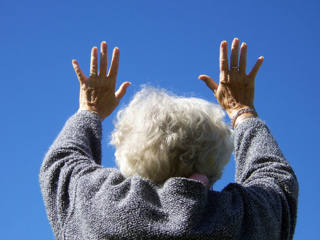arms stretched towards the sky