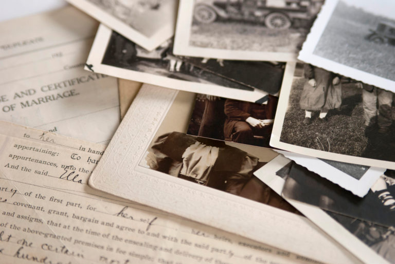 Genealogy family history theme with old family photos and documents.