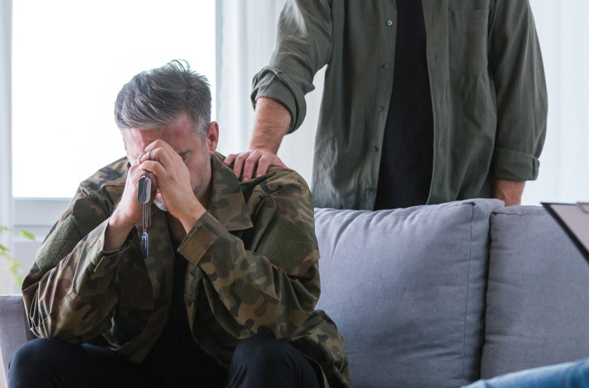 Distressed veteran being comforted. Veterans Resources