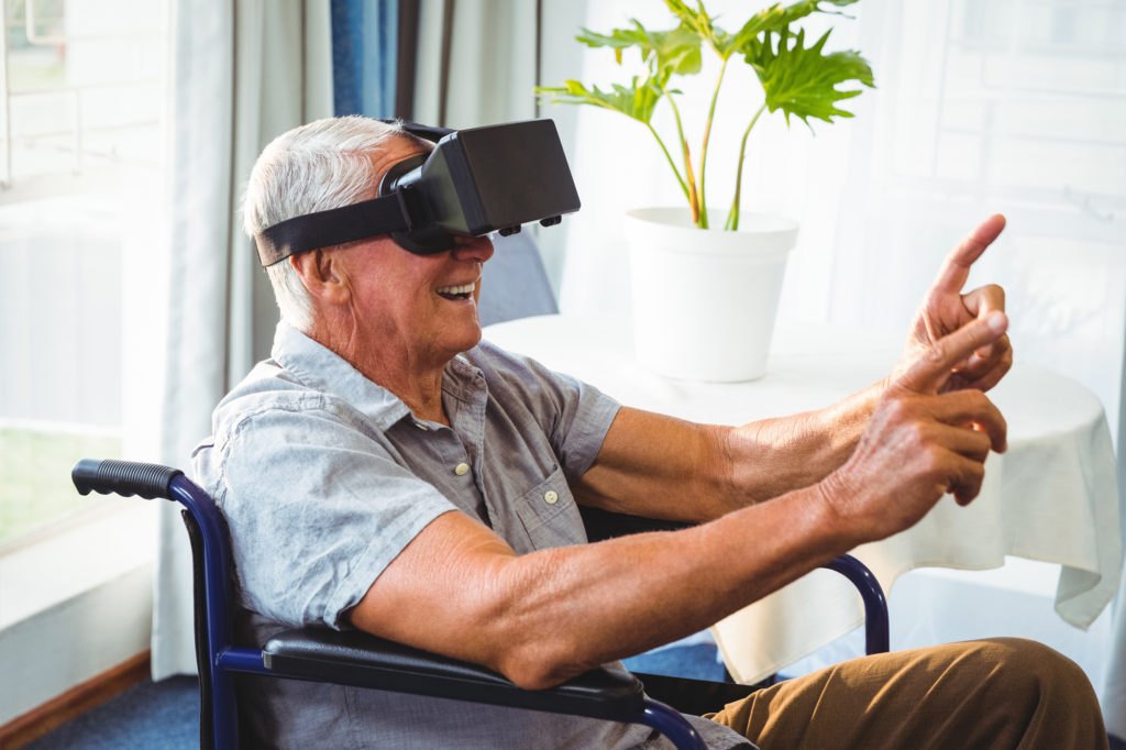 Senior wearing VR glasses. Dementia Reality program