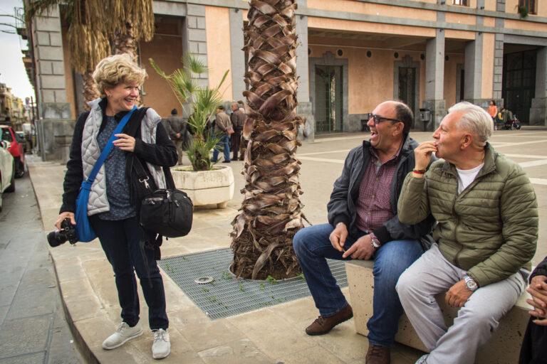 Patricia Solano in a Sicilian piazza. Photography offers a retired Spanish teacher inspiration, purpose, and reason for travel