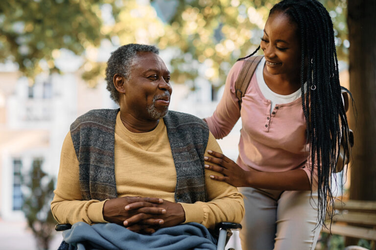 Young woman taking care of senior adult showing the concept of specialized care