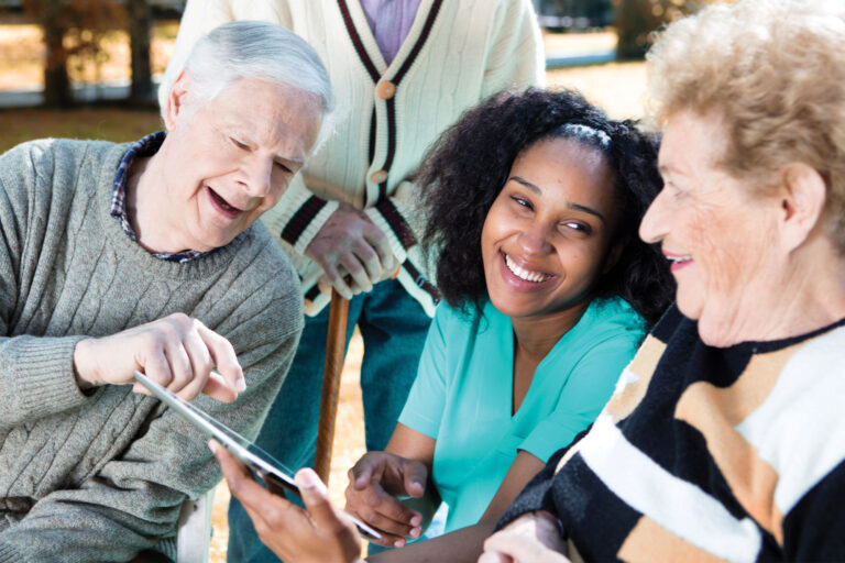 Healthcare provider explaining medical information to elderly couple. Health literacy and memory topic