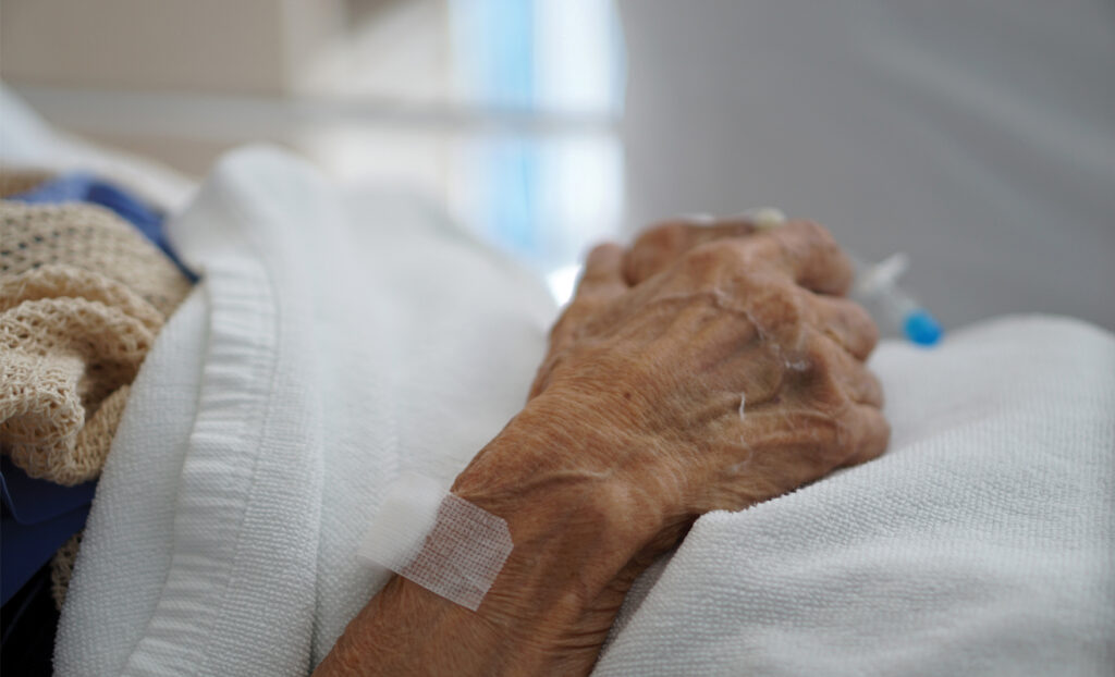 Elder emergencies. Senior in a hospital bed