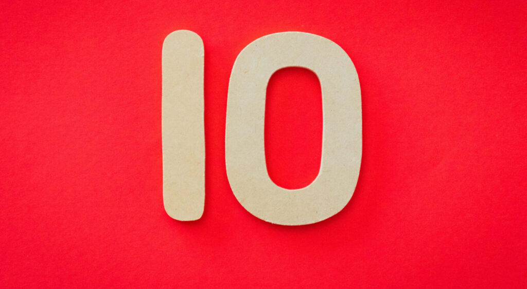The number 10 in tan color set against a red background