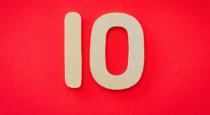 The number 10 in tan color set against a red background