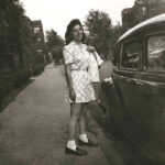 Mary-Holtzblatt_standing-by-car.1000