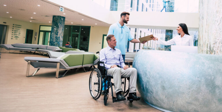 Discharge planning and care navigation. Man being discharged from a hospital stay.