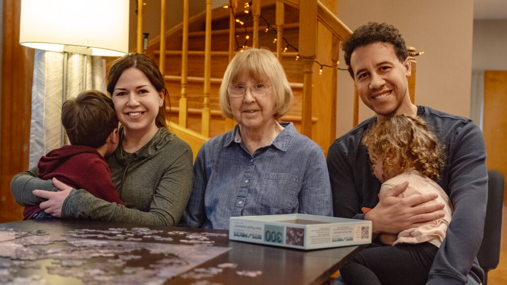 Adults from left: Emily Ellison, Barbara Friz-Ellison and Neo Ellison. A family who cares for young children and a senior adult simultaneously. Concept of sandwich caregiving.